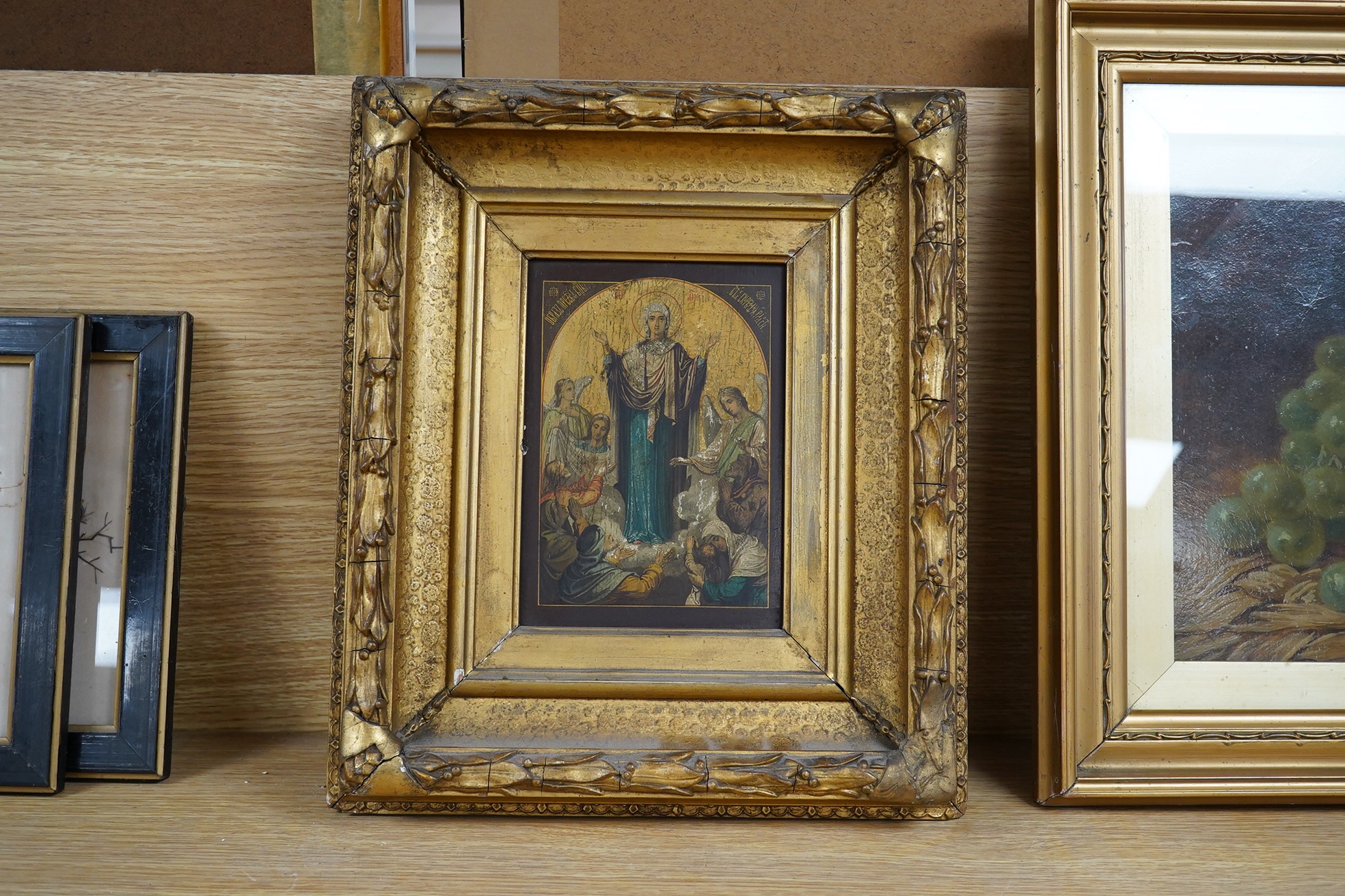 Contemporary Russian icon with Cyrillic script, 17 x 12cm, ornate gilt frame. Condition - fair